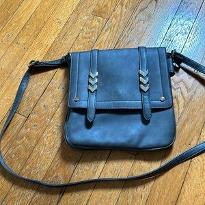 Charcoal gray crossbody bag. Multiple large pockets.